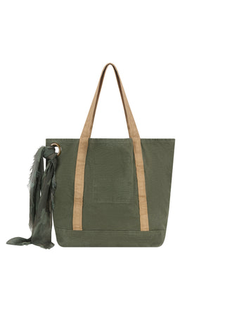 an-olive-green-canvas-tote-bag-with-tan-shoulder-straps-and-a-matching-dark-green-scarf-hanging-from-a-metal-ring-on-the-left-side-shown-against-a-plain-white-background