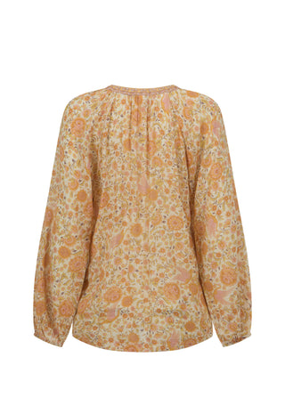a-long-sleeve-blouse-with-a-gathered-pleated-back-neckline-featuring-an-all-over-floral-pattern-in-shades-of-orange-yellow-and-beige-on-a-white-background